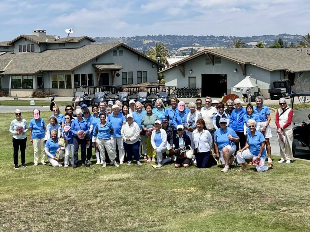 Alameda Post - A group of golfers pose for a photo on the green. 