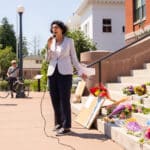 Alameda Post - Alameda Mayor Marilyn Ezzy Ashcraft stands and speaks into a microphone next to City Hall