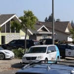 Alameda Post - Officers leaving the scene where multiple people were shot and killed on Kitty Hawk Road in Alameda on July 10, 2024.