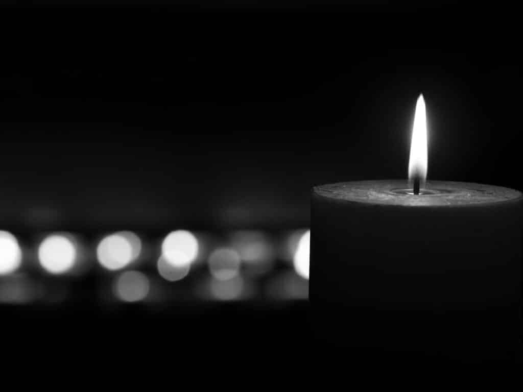Alameda Post - a black and white photo of a lit candle