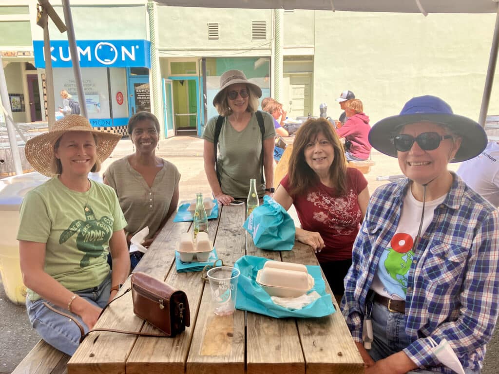 Alameda Post - five members of an Alameda Beach Clean-up crew smile at a celebratory lunch 