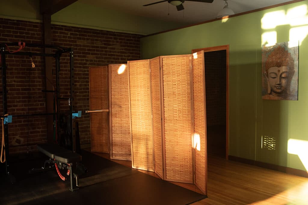 Alameda Post - a section of the inside of Svastha Yoga Wellness and Community Hub, including a divided section for privacy 