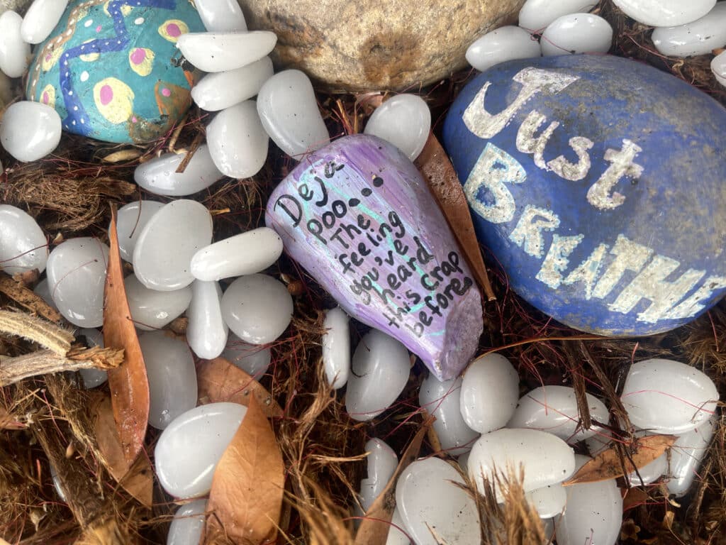 Alameda Post - rocks in a fairy garden with messages on them