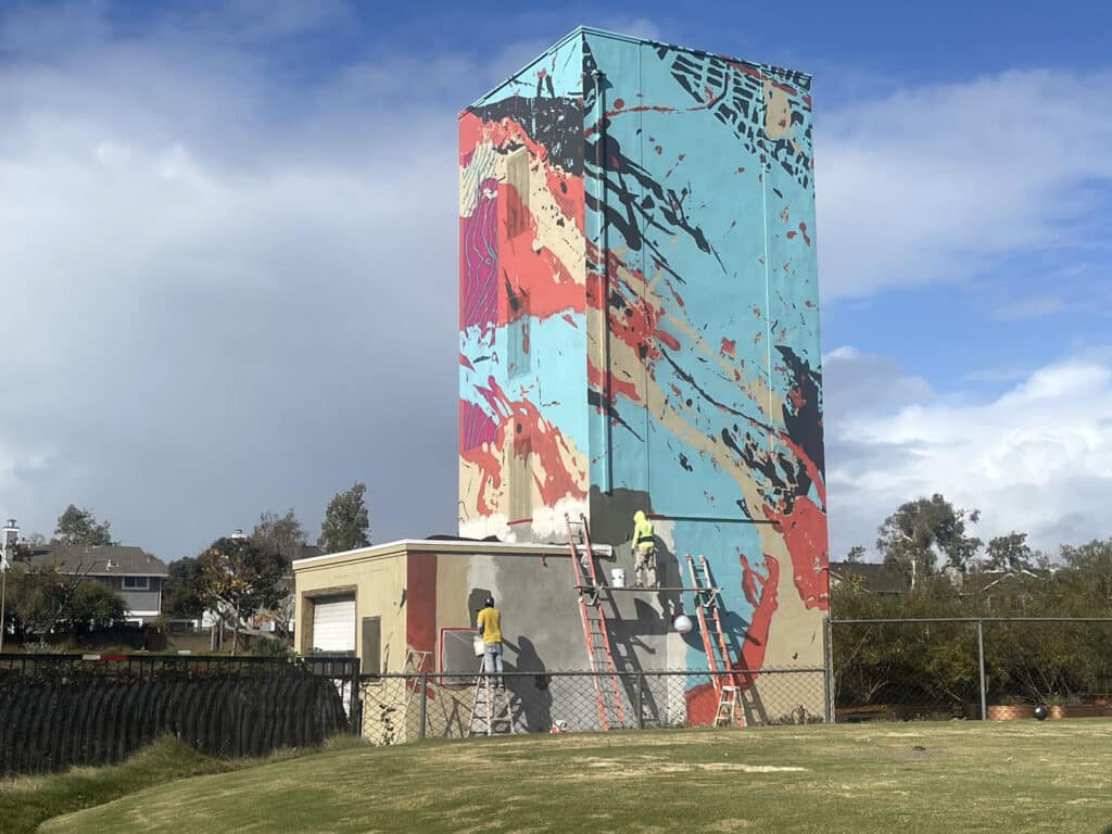 Alameda Post - a fire tower with a mural on it