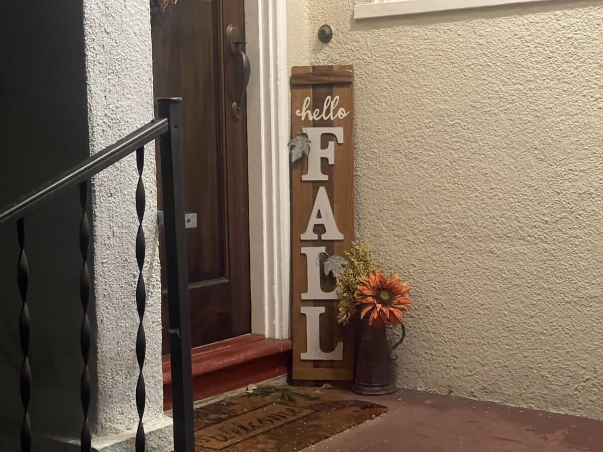 Alameda Post - next to someone's front door, a sign reads "Hello Fall"