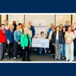 Alameda Post - a group of Windermere and local nonprofit leaders with a large check