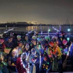 Alameda Post - a group photo of the KP Dragon, an entry in the Lighted Yacht Parade