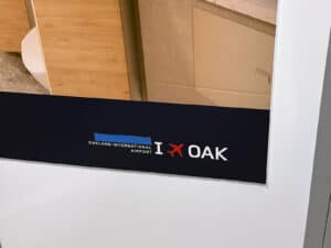 Alameda Post - a sign at the OAK airport that was newly created saying "San Francisco Bay Oakland International Airport." Blue tape is now covering the "San Fransisco Bay" portion