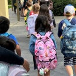 Alameda Post - young children in backpacks line up