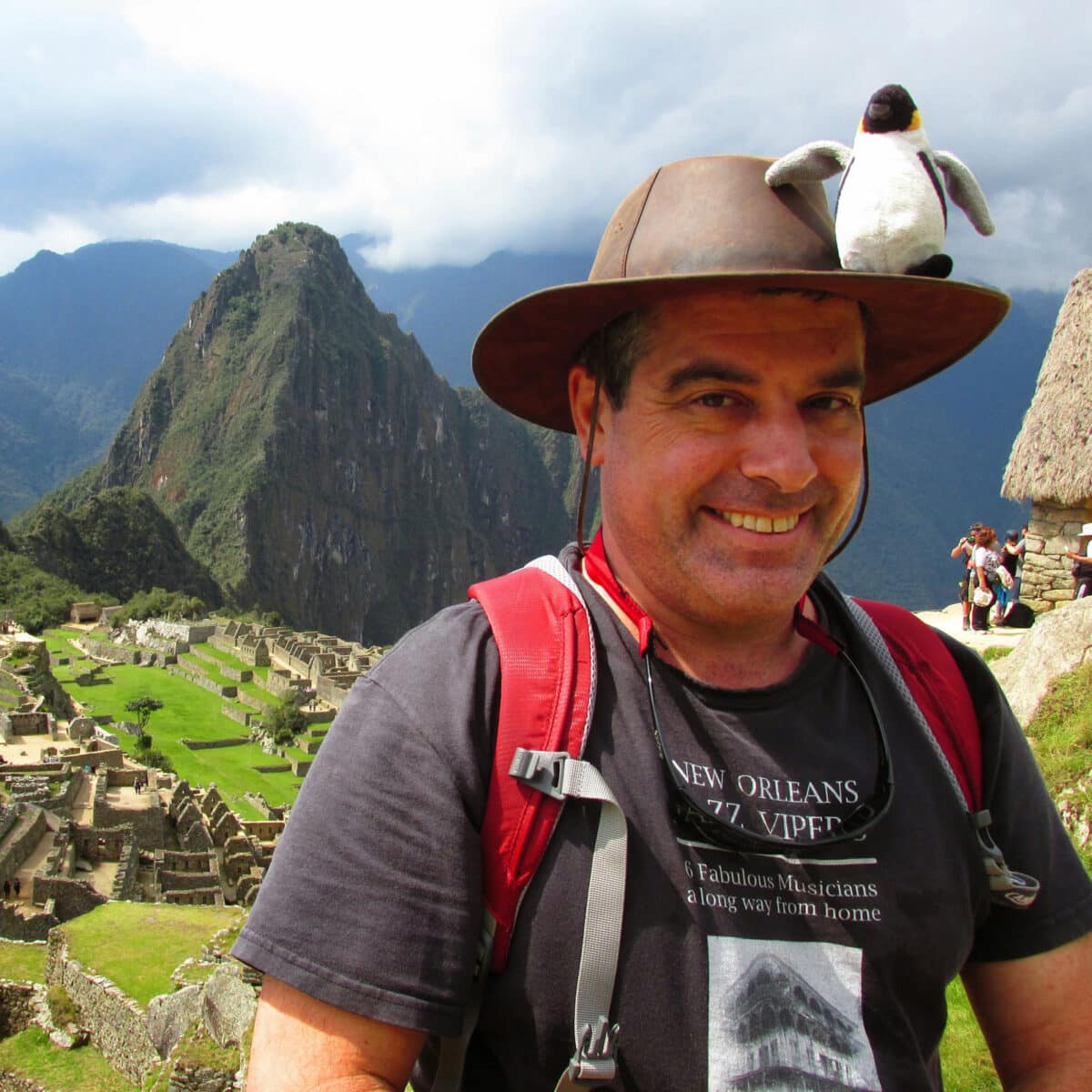 Alameda Post - Armando Fox stands for a photo at Machu Picchu
