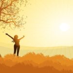Alameda Post - an image of a person standing outdoors raising their arms to the sun