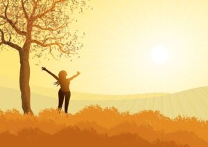 Alameda Post - an image of a person standing outdoors raising their arms to the sun