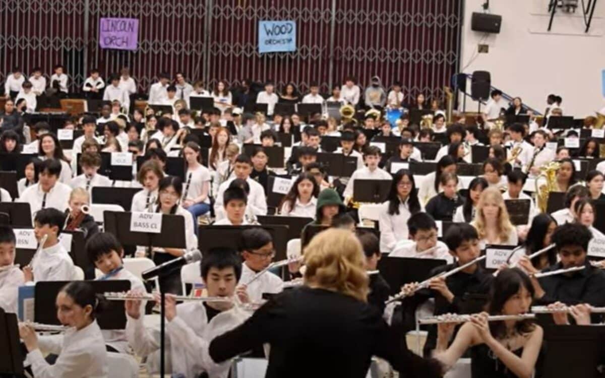 Alameda Post - a photo of the All City Band Concert, with a huge band being conducted by a director