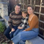 Alameda Post - Eric Schoeffler sits on a bench with a woman and young boy
