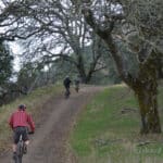 Alameda Post - a family out for a bike ride on a wide dirt path