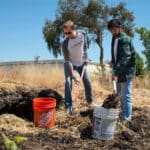 Alameda Post - two people shovel at REAP