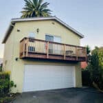 Alameda Post - a rental unit with a porch sits on the second story above a garage