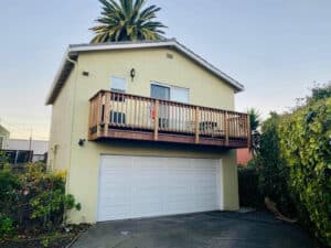 Alameda Post - a rental unit with a porch sits on the second story above a garage