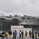 Alameda Post - 2025 Carrier Con attendees lined up outside the USS Hornet waiting to enter.