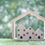 Alameda Post - an image of small wooden representations of apartments or houses