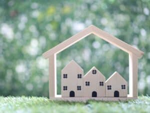 Alameda Post - an image of small wooden representations of apartments or houses
