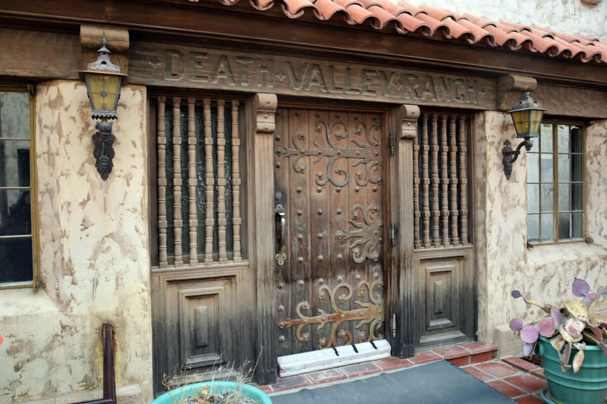 Alameda Post - an elaborate door with the words Death Valley Ranch carved above them
