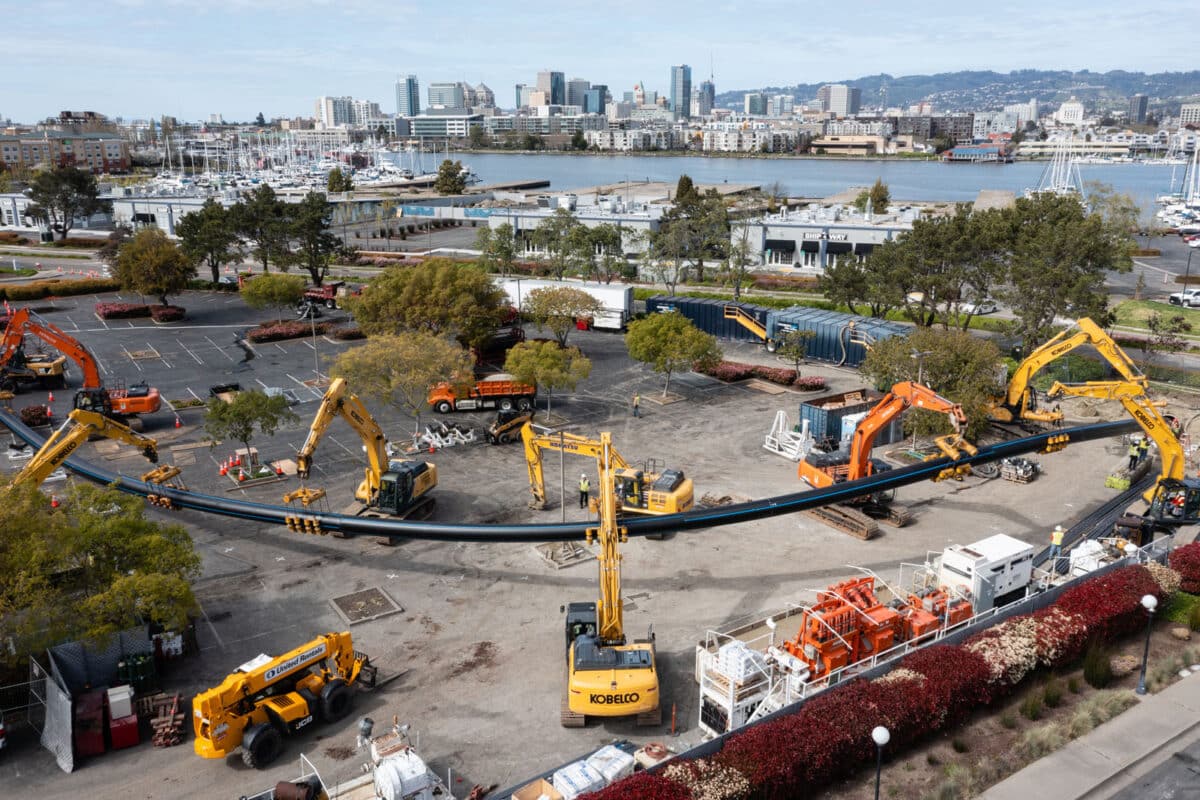 Alameda Post - a construction site with lots of heavy equipment where pipes are going into the ground