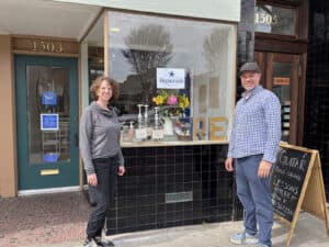 Alameda Post - a husband and wife stand in front of the window or Replenish Marketplace