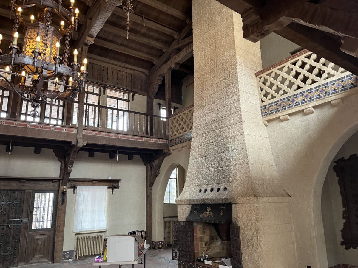 Alameda Post - a large living room of wood, stone, and other natural but luxurious materials