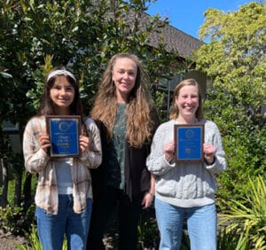 Alameda Post - a student, teacher, and principal all stand together. The student is Kennedy Fong, the Principal is Annalisa Moore, and Teacher is Erica Tolaio.