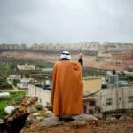 Alameda Post - a person stands and looks out over Wadi Foquin