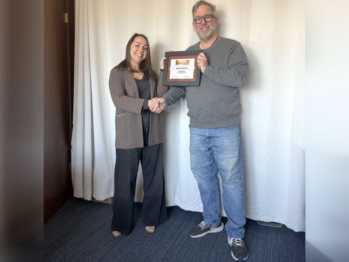 Alameda Post - Publisher Adam Gillitt presents Managing Editor Kelsey Goeres with her certificate