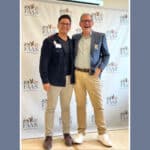 Alameda Post - two well dressed men, Adrien Abuyen and John Lipp, stand together and smile