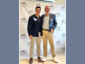 Alameda Post - two well dressed men, Adrien Abuyen and John Lipp, stand together and smile