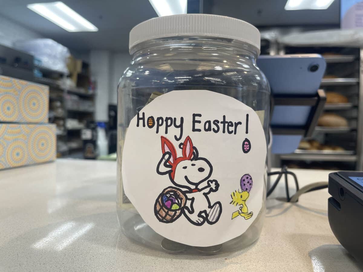 Alameda Post - a tip jar that says Happy Easter with a snoopy and woodstock drawing