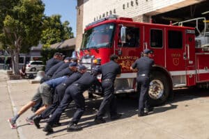 Alameda Post - AFD Alameda firefighters push their new truck 1 into the station
