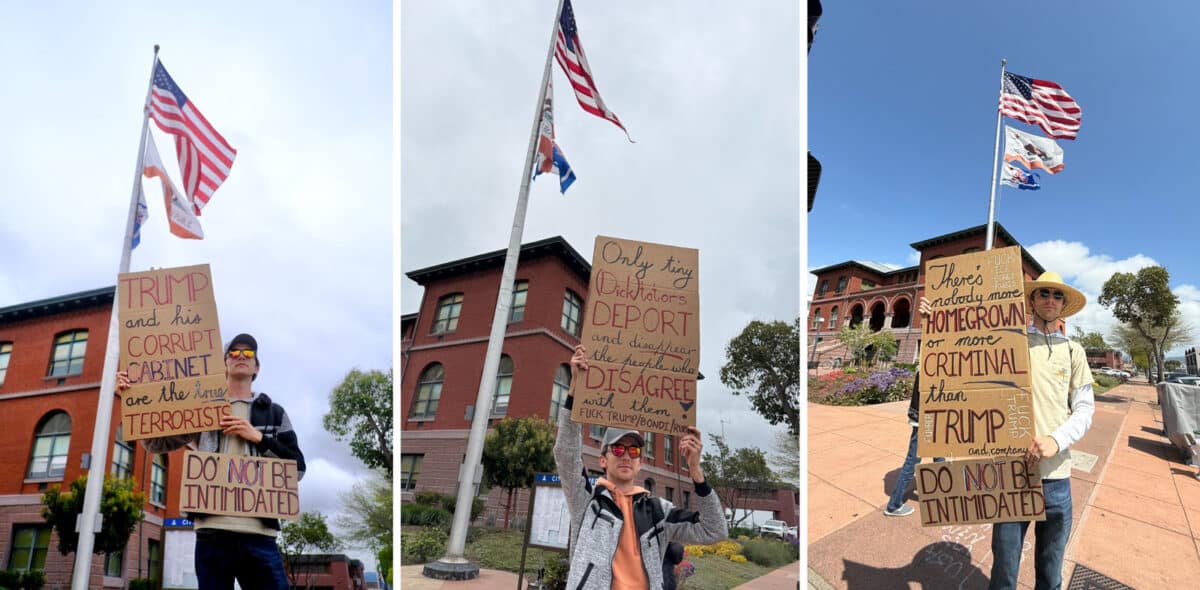 Alameda Post - a man stands in front of Alameda City Hall with signs that say "Trump and his corrupt (Nazi) Cabinet are the true terrorists. Do not be intimidated." and other similar signs