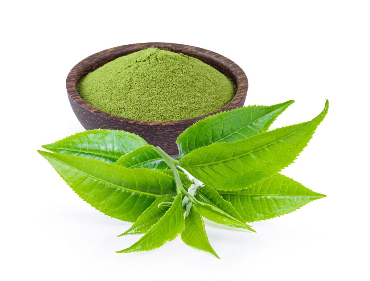 Alameda Post - powdered matcha green tea in bowl with leaf isolated on white background