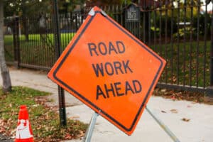 Alameda Post - a sign that says Road Work Ahead