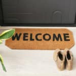 Alameda Post - a welcome mat in front of a home
