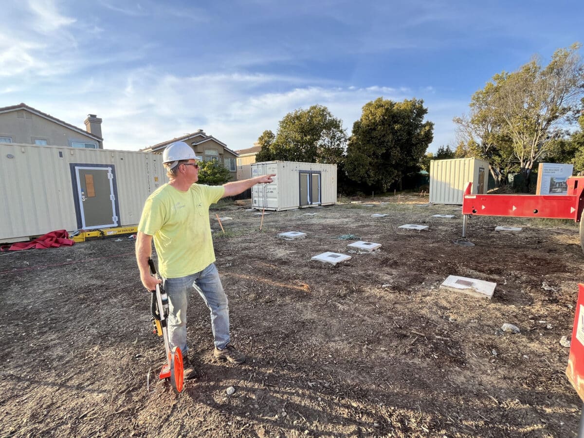 Alameda Post - on the construction site for the future FAMST campus, a man points across the area