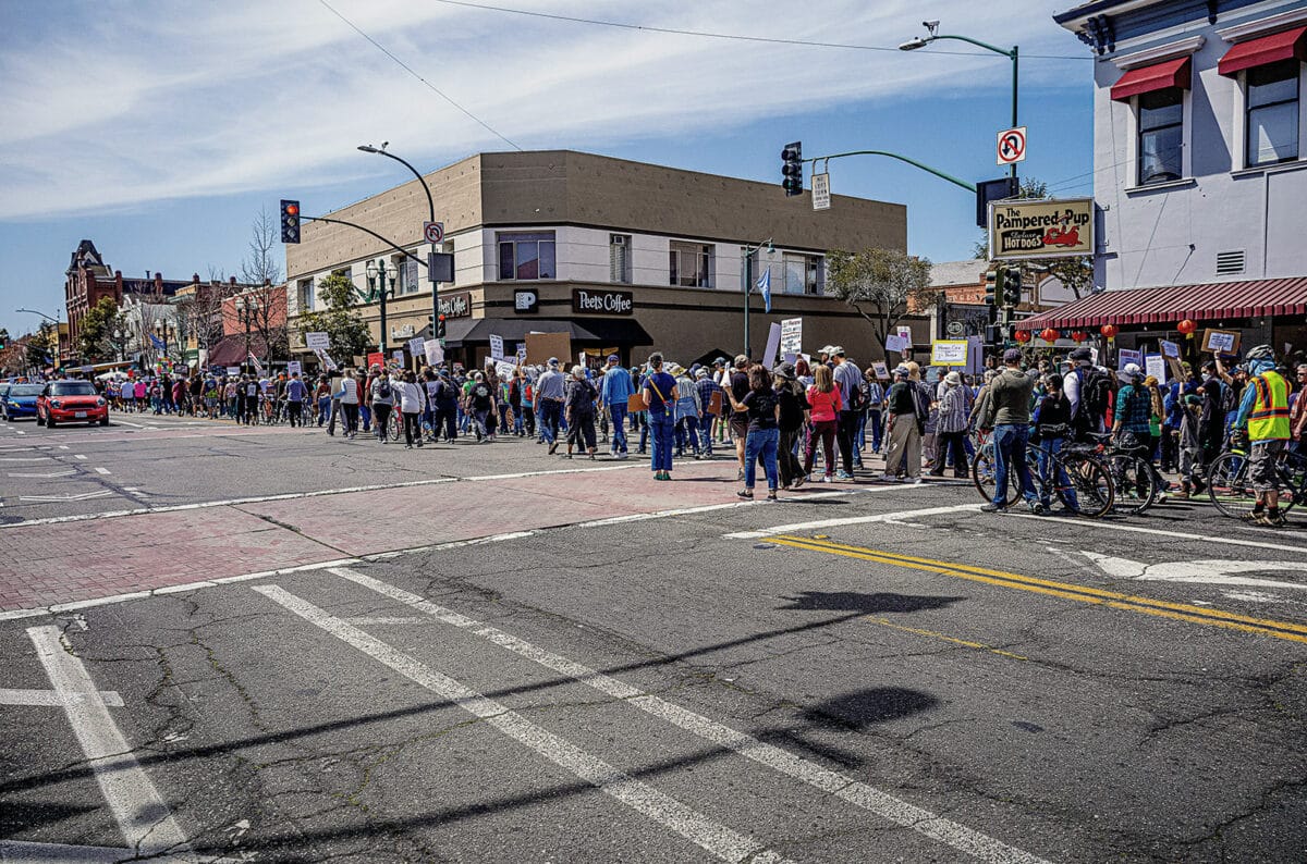 Protestors march along Park Street towards South Shore on April 5, 2025 Hands Off Rally in Alameda, CA. Photo Hans Dieter Siebert.