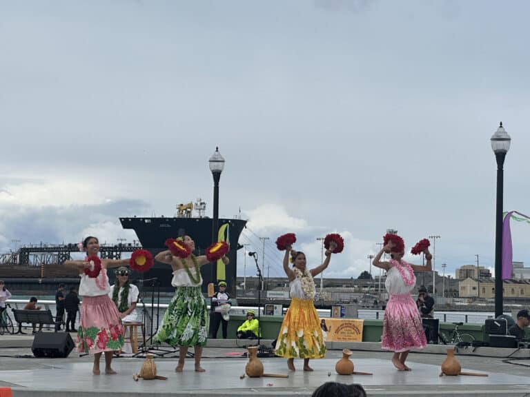Alameda Post - four performers in bright clothing perform at the Asian & Pacific Islander Arts & Culture Festival