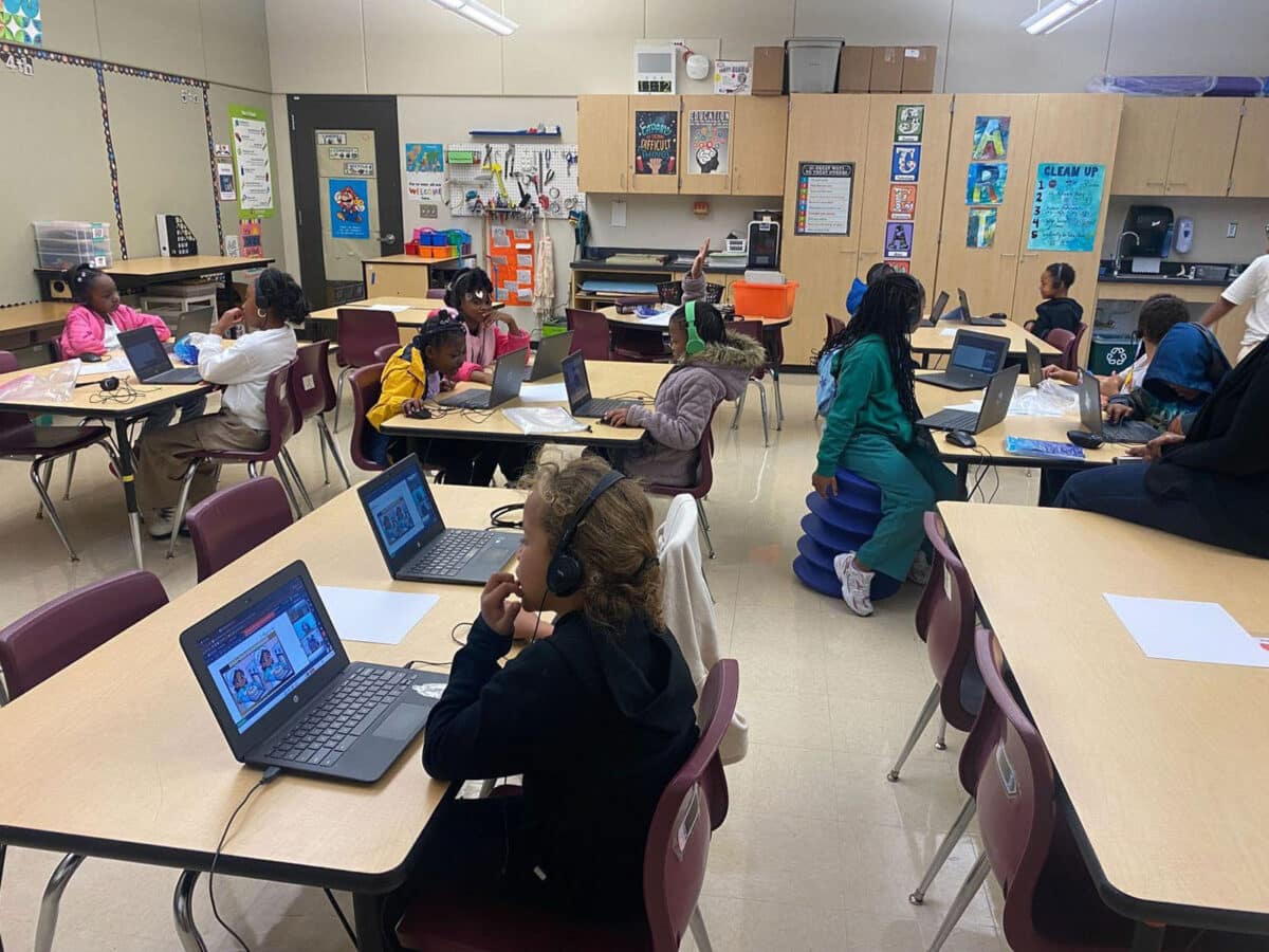 Alameda Post - students sit in an AUSD classroom and complete an assignment or activity on laptops during the Black Math Genius program