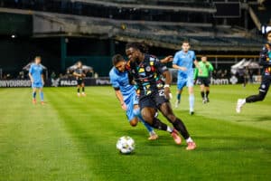 Alameda Post - an Oakland Roots player controls the ball in a match against Las Vegas Lights