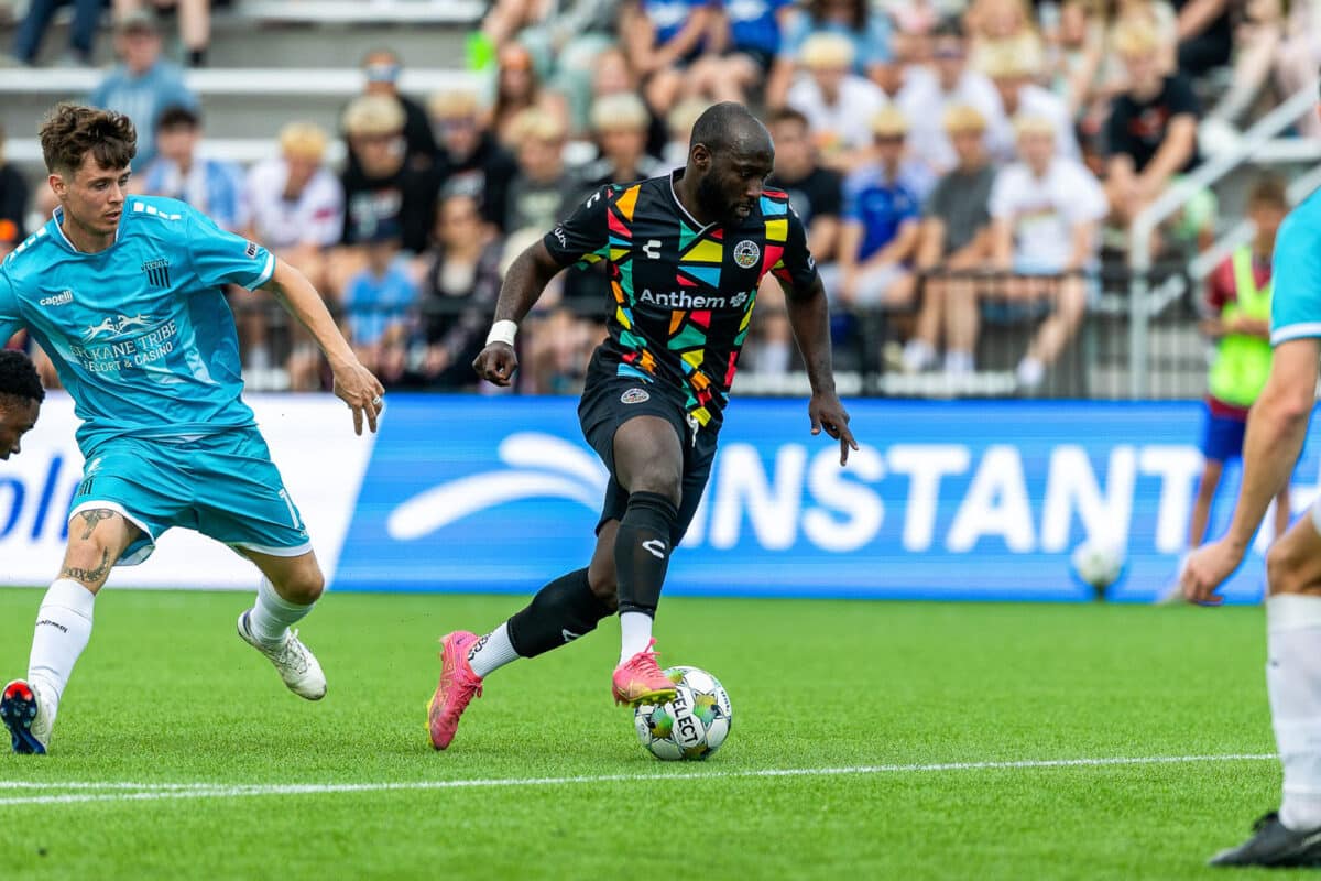 Alameda Post - an Oakland Roots player dribbles the ball in a match against Spokane Velocity