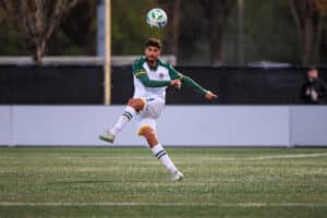 Alameda Post - an Oakland Roots player kicks the ball in the match against Tacoma Defiance