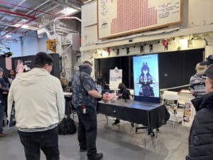 Alameda Post - a fan speaks into a camera to a Vtuber who is seen on a screen