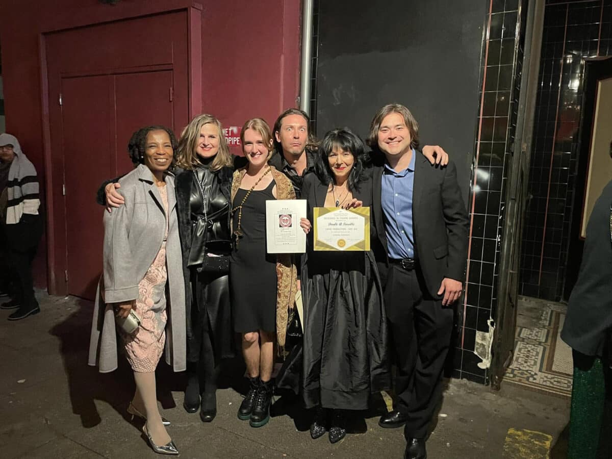 Alameda Post - six members of the Altarena Playhouse stand with awards and smile