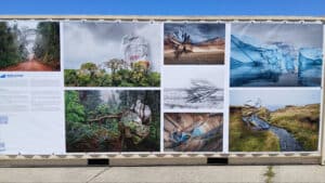 Alameda Post - photographs of landscapes displayed on the side of a shipping container at FOCUS Fest. They include icebergs, rivers, forests, and deserts